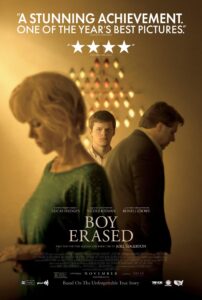 The poster for Boy Erased features a soft, warm-toned composition with three characters: Lucas Hedges centered and facing forward, framed by Nicole Kidman and Russell Crowe turned away in emotional poses. The background shows a lit cross-shaped pattern, suggesting a religious setting. The tagline reads: “Based On The Unforgettable True Story.” Praise and star ratings are quoted above. The title is in a classic serif font, and below are credits for cast and crew including Joel Edgerton as writer and director.