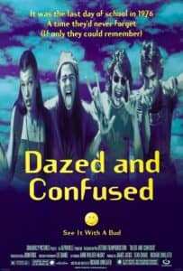 A psychedelic poster featuring four teenagers from the 1970s flashing peace signs and goofy expressions. Text reads: “It was the last day of school in 1976 — A time they’d never forget (If only they could remember).” The title Dazed and Confused is written in bright yellow with a smiley face below.