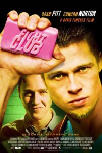 Poster for Fight Club featuring Brad Pitt holding a bright pink bar of soap labeled “FIGHT CLUB” in bold letters, with Edward Norton smirking in the background. The tagline at the bottom reads “Mischief. Mayhem. Soap.” The gritty, high-contrast style reflects the film’s rebellious and psychological themes.