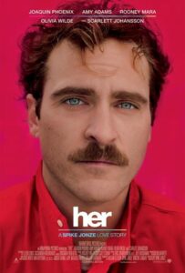 Poster for Her featuring a close-up of Joaquin Phoenix with a thick mustache, red shirt, and intense blue eyes, set against a solid hot pink background. The minimalist design highlights the film’s introspective tone. The tagline reads: “A Spike Jonze Love Story.”