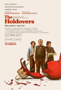 An illustrated poster shows three characters — a grumpy-looking older man in a sweater vest, a bandaged student with curly hair, and a stern woman holding folded laundry — standing solemnly over a shattered Christmas tree ornament. The broken red glass hints at both holiday chaos and emotional upheaval. The tagline reads “Discomfort And Joy.”