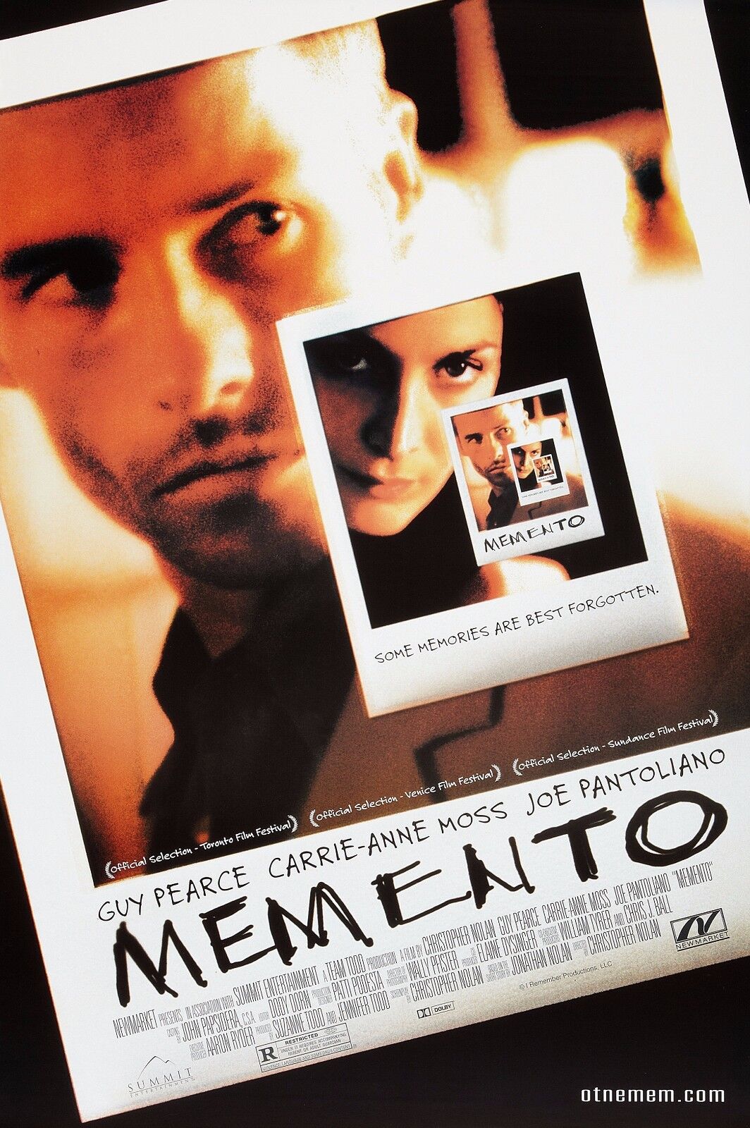 Poster for the film Memento, featuring a recursive image of a Polaroid photograph within a photograph. The main image shows Guy Pearce's character looking off to the side, with a Polaroid of Carrie-Anne Moss layered over his chest. Below the photo is the tagline: “Some memories are best forgotten.”
