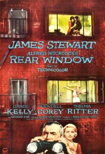 A dramatic poster shows James Stewart peering through binoculars, with Grace Kelly beside him, set against the backdrop of a red-brick apartment complex. The windows reveal glimpses of neighbors’ lives, hinting at voyeurism and mystery. Alfred Hitchcock’s name dominates the design, evoking suspense and psychological tension.