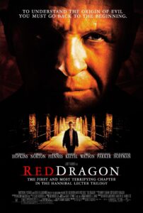Poster for Red Dragon, featuring a massive, ominous close-up of Anthony Hopkins as Hannibal Lecter, his face half-lit in fiery tones. Below, Edward Norton walks down a shadowy corridor of brick archways. The tagline reads: “To understand the origin of evil, you must go back to the beginning.” Subtext describes it as “The first and most terrifying chapter in the Hannibal Lecter trilogy.”