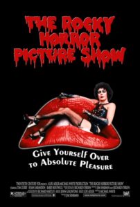 Poster for The Rocky Horror Picture Show featuring Tim Curry in costume as Dr. Frank-N-Furter, reclining on oversized red lips against a black background. The film’s dripping red title font and the tagline “Give Yourself Over to Absolute Pleasure” evoke its bold, campy, and transgressive cult-classic style.