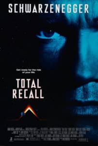 Poster for Total Recall, featuring a close-up of Arnold Schwarzenegger’s intense blue-lit face against a starry space background. Below him is a stylized Martian pyramid glowing with planetary bodies around it. The tagline reads: “Get ready for the ride of your life.”