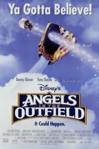Movie poster for Angels in the Outfield featuring a glowing baseball soaring through the sky toward a large glove with a trail of sparkling light, evoking magical intervention. The tagline reads, “Ya Gotta Believe!” with cast members Danny Glover, Tony Danza, and Christopher Lloyd listed above the title.