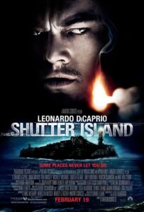 Poster for Shutter Island featuring a close-up of Leonardo DiCaprio’s intense expression partially lit by the flame of a match he’s holding. Below him is a dark, stormy image of the island asylum, with bold text of the film’s title and tagline: “Some places never let you go.” The mood evokes mystery, paranoia, and psychological tension.