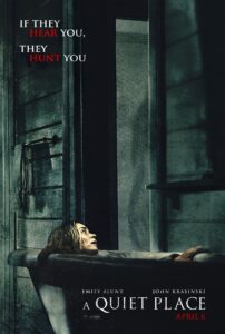 Movie poster for A Quiet Place featuring a terrified woman (Emily Blunt) lying low in a bathtub inside a dimly lit, weathered bathroom, looking up with wide eyes and an open mouth in silent agony. The top left corner displays the tagline “IF THEY HEAR YOU, THEY HUNT YOU” in white and red text. The film title A QUIET PLACE appears at the bottom alongside the lead actors' names, Emily Blunt and John Krasinski, set against dark, muted teal and shadow tones evoking intense dread and suspense.